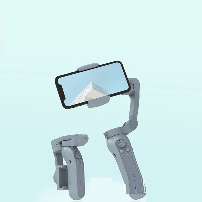 Handheld device with smartphone holder and control panel on a light blue background